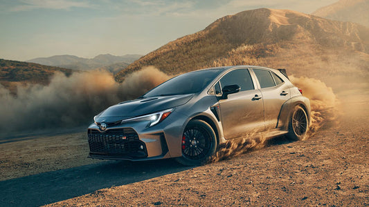 Grey GR Corolloa drifting in dirt